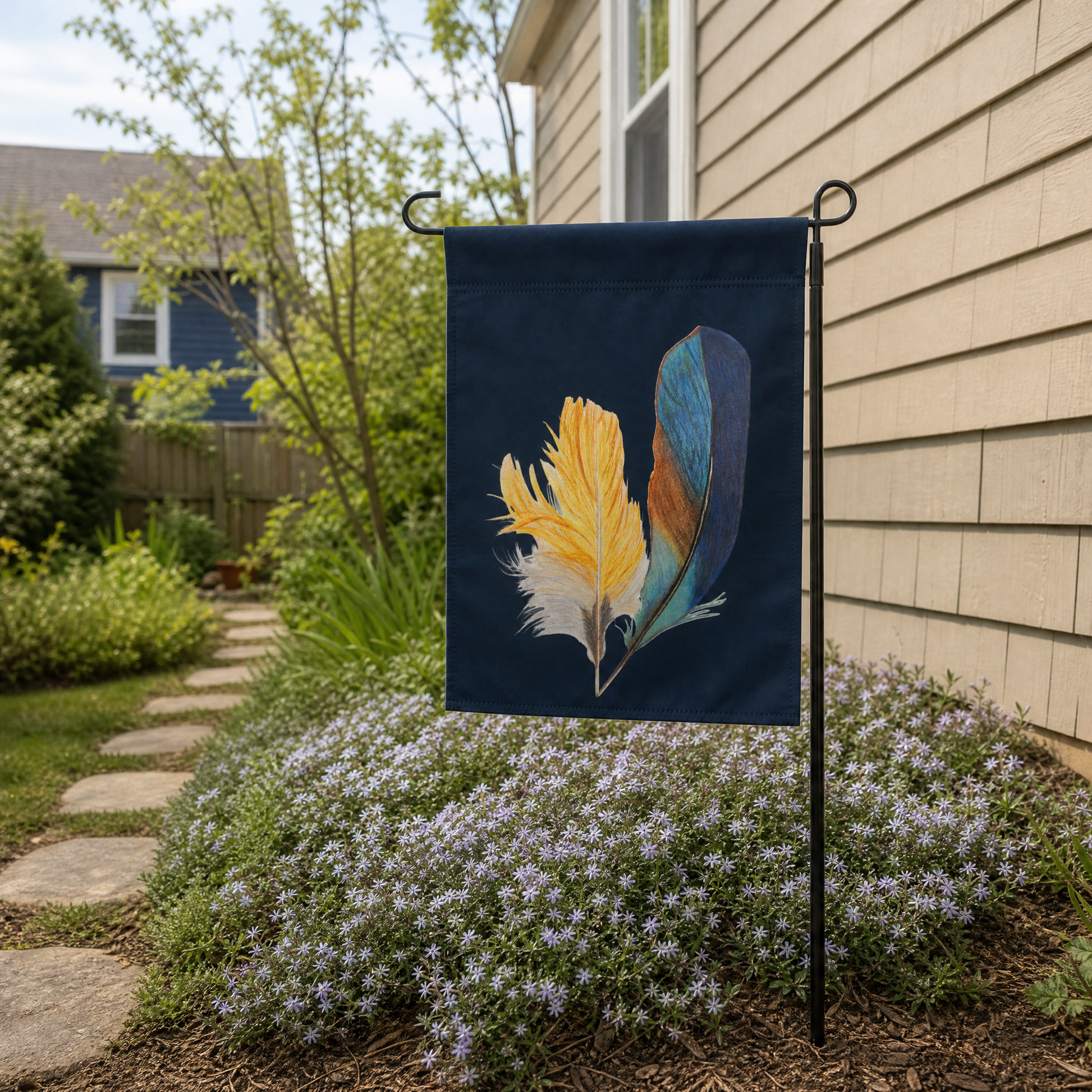 Garden flag with hand drawn kingfisher feather design on side of a house